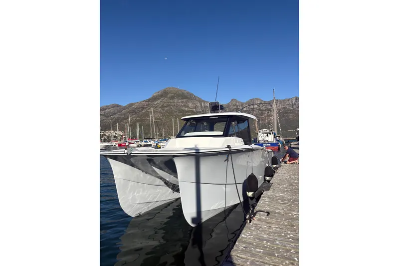 Hammercat 35hh Yacht Photos Pics 2026 Hammer Yachts 35HH catamaran docked at marina with mountain backdrop.