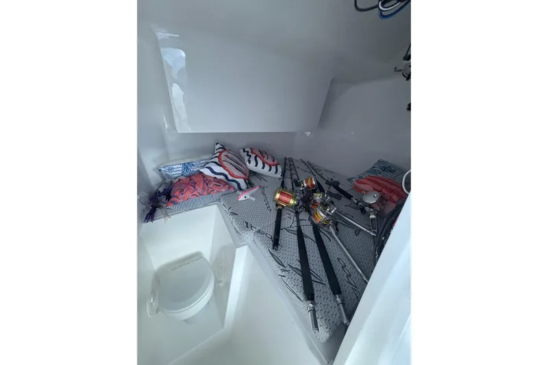 Hammercat 35hh Yacht Photos Pics Interior of 2026 Hammer Yachts 35HH with fishing rods and colorful cushions.