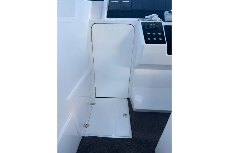 Hammercat 35hh Yacht Photos Pics Interior view of 2026 Hammer Yachts 35HH, featuring sleek white paneling and control buttons.