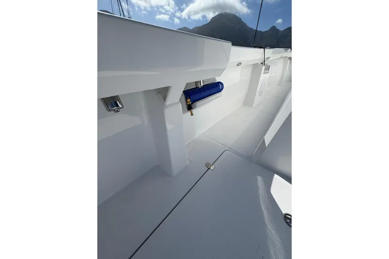 Hammercat 35hh Yacht Photos Pics 2026 Hammer Yachts 35HH deck with sleek design and blue coiled hose.