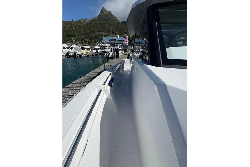 Hammercat 35hh Yacht Photos Pics 2026 Hammer Yachts 35HH docked, showcasing sleek design and marina backdrop.