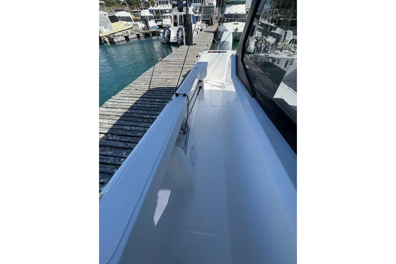 Hammercat 35hh Yacht Photos Pics 2026 Hammer Yachts 35HH docked, showcasing sleek deck design and marina view.
