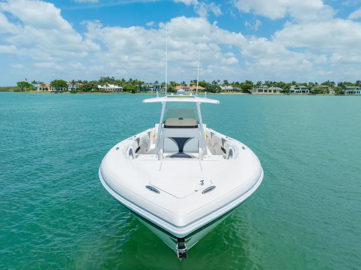 Freaky Fast Yacht Photos Pics 2018 Intrepid 375 Open boat on turquoise water under blue sky.