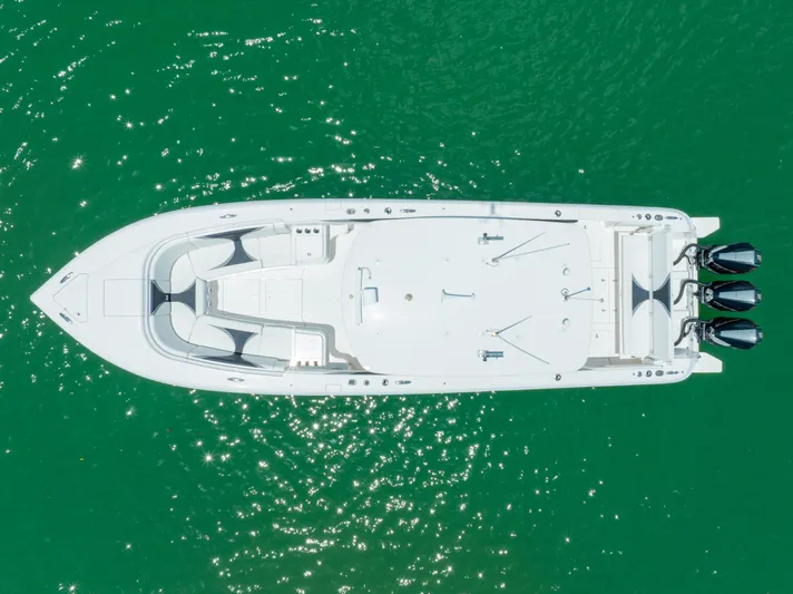 Freaky Fast Yacht Photos Pics Aerial view of 2018 Intrepid 375 Open boat on green water.