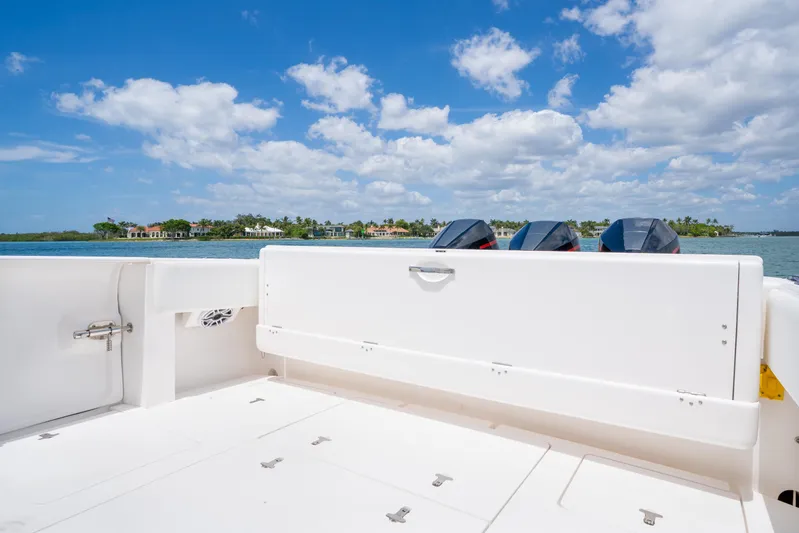 Freaky Fast Yacht Photos Pics 2018 Intrepid 375 Open boat deck with outboard motors, under a clear blue sky.