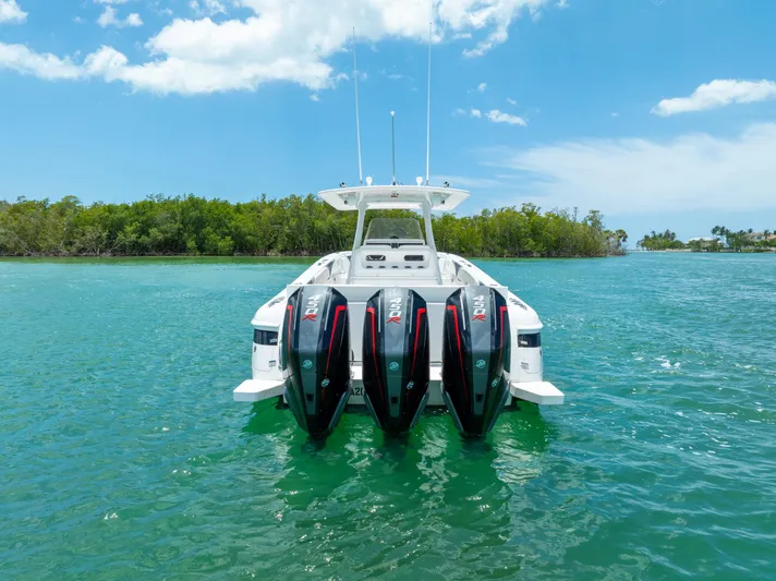 Freaky Fast Yacht Photos Pics 2018 Intrepid 375 Open boat with triple engines on turquoise water, clear sky background.