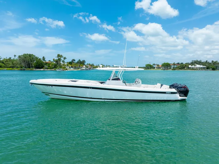 Freaky Fast Yacht Photos Pics 2018 Intrepid 375 Open boat on clear blue water under a sunny sky.