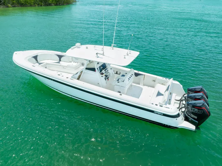 Freaky Fast Yacht Photos Pics 2018 Intrepid 375 Open boat on clear turquoise water.