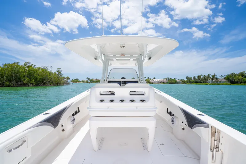 Freaky Fast Yacht Photos Pics 2018 Intrepid 375 Open boat on clear water under blue sky.