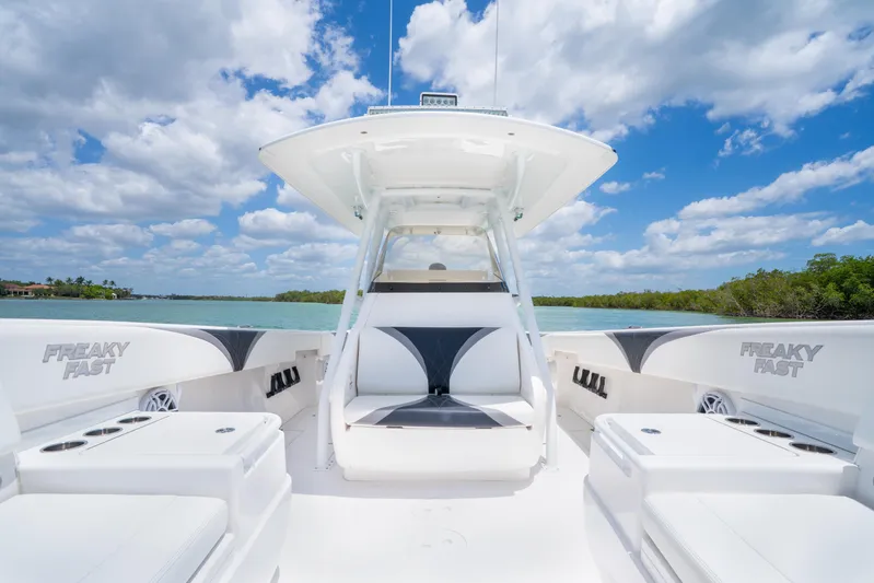 Freaky Fast Yacht Photos Pics 2018 Intrepid 375 Open boat on water, clear sky, spacious seating, sleek design.