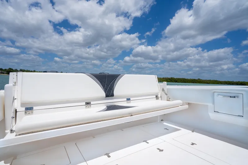 Freaky Fast Yacht Photos Pics 2018 Intrepid 375 Open boat with white seating under a blue sky.