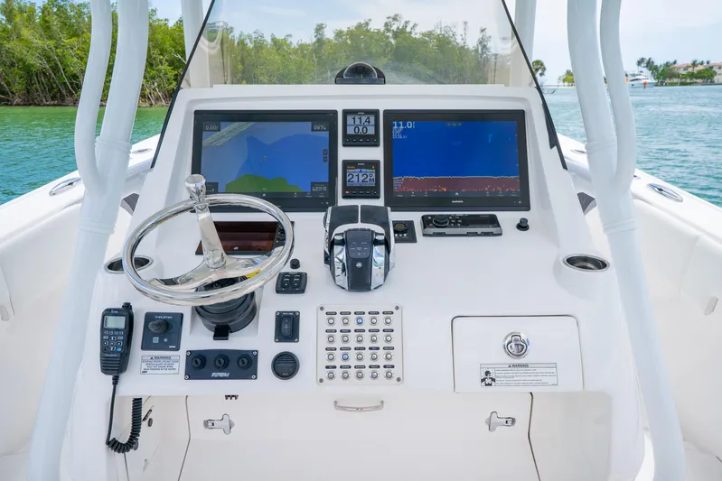 Freaky Fast Yacht Photos Pics 2018 Intrepid 375 Open boat dashboard with navigation screens and controls.