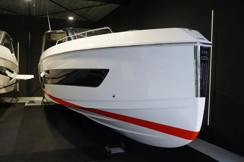  Yacht Photos Pics 2025 Schaefer V44 yacht with sleek design and red accent, showcased indoors.