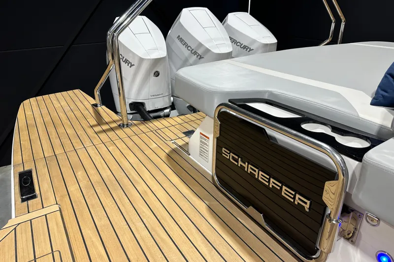  Yacht Photos Pics Schaefer V44 2025 boat with Mercury engines and sleek wooden deck design.