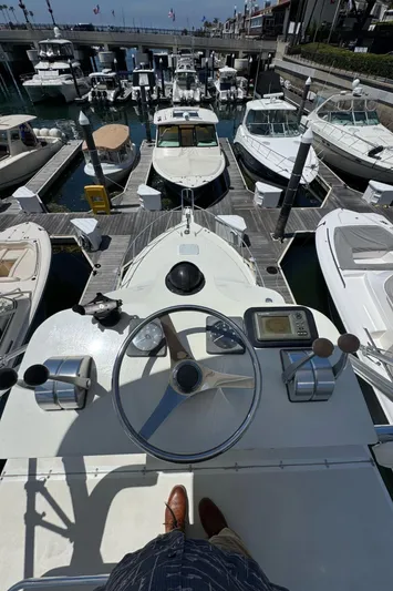 No Problem Yacht Photos Pics View from Cabo 35 Express 1998 helm overlooking marina with multiple docked boats.