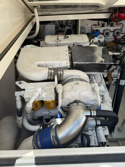 No Problem Yacht Photos Pics Engine compartment of a 1998 Cabo 35 Express boat, showcasing mechanical components.