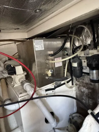 No Problem Yacht Photos Pics Engine room of 1998 Cabo 35 Express boat with mechanical components.