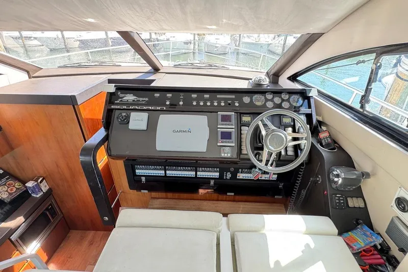  Yacht Photos Pics Cockpit inside A/C'd salon w/ Garmin navigation system and modern controls.