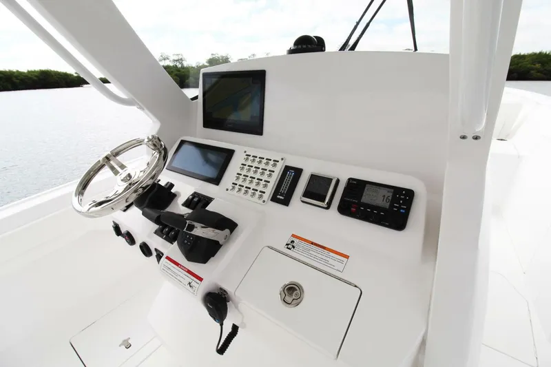  Yacht Photos Pics 2024 Intrepid 375 Nomad SE helm with advanced navigation and control systems.