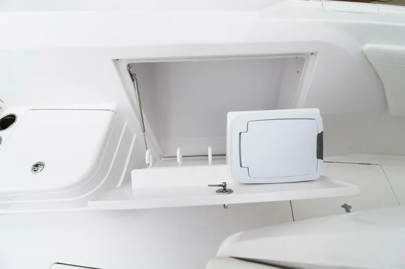  Yacht Photos Pics 2024 Intrepid 375 Nomad SE boat storage compartment with open hatch and sleek design.