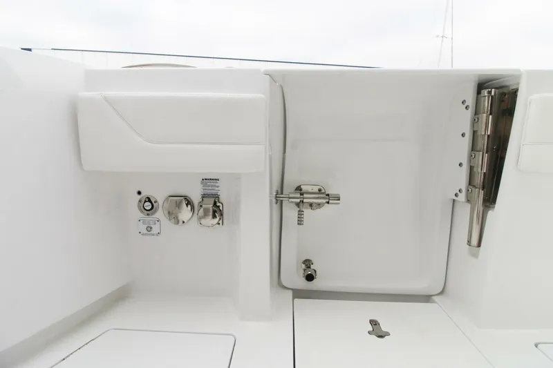  Yacht Photos Pics 2024 Intrepid 375 Nomad SE boat deck with utility access and storage features.
