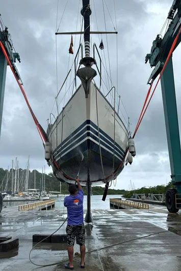 Sv Magi Yacht Photos Pics X-Yachts 442 MK II sailboat being lifted for maintenance at a marina.