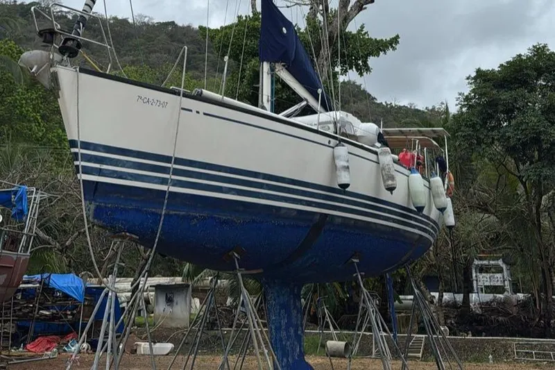 Sv Magi Yacht Photos Pics Sailboat X-Yachts 442 MK II 2000 on stands, ready for maintenance in a boatyard.