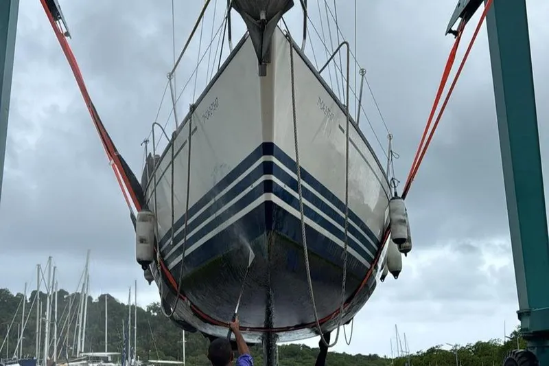 Sv Magi Yacht Photos Pics Sailboat X-Yachts 442 MK II 2000 being lifted for maintenance at a marina.