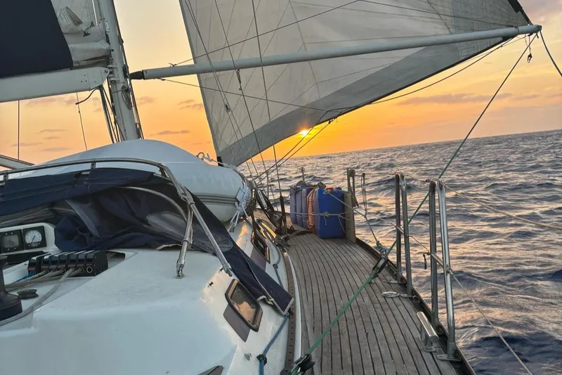 Sv Magi Yacht Photos Pics Sailing yacht X-Yachts 442 MK II, 2000 model, at sunset on open sea.