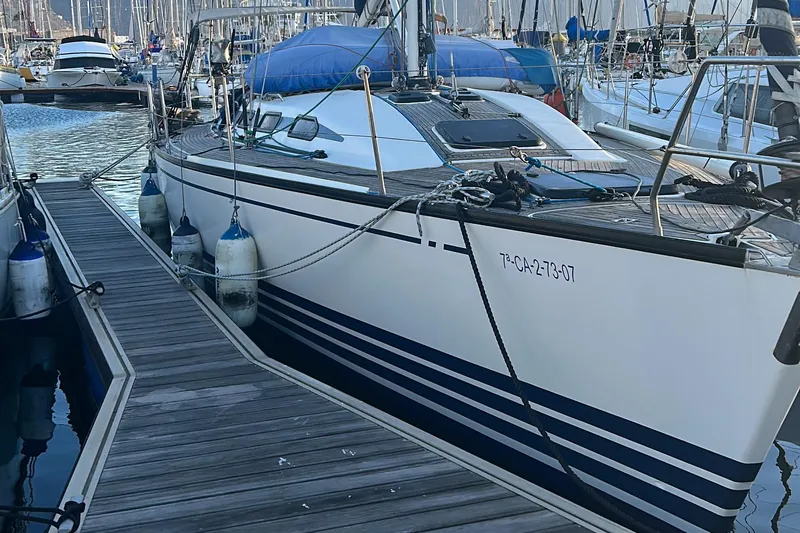Sv Magi Yacht Photos Pics 2000 X-Yachts 442 MK II sailboat docked in a marina, surrounded by other boats.