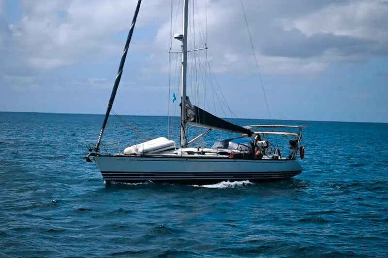 Sv Magi Yacht Photos Pics 2000 X-Yachts 442 MK II sailing on open sea under cloudy sky.