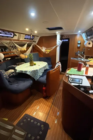 Sv Magi Yacht Photos Pics Interior of 2000 X-Yachts 442 MK II with cozy seating and dining area.