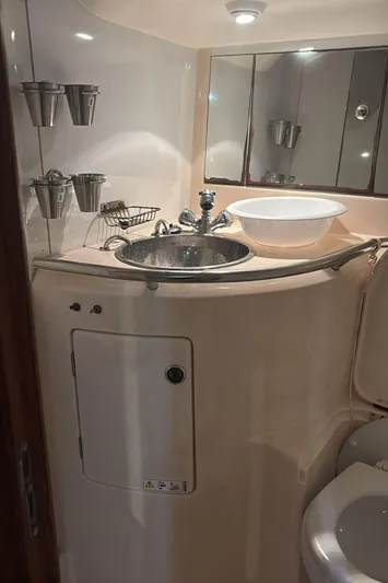Sv Magi Yacht Photos Pics Compact bathroom in 2000 X-Yachts 442 MK II with sink and mirror.
