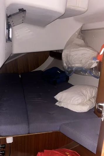 Sv Magi Yacht Photos Pics Cozy cabin interior of 2000 X-Yachts 442 MK II with bedding and storage.