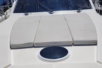2007 Astondoa 53 Open yacht with sunbathing cushions and sleek design.
