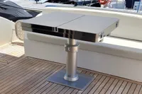 Luxury yacht deck with sleek table, Astondoa 53 Open, 2007 model.