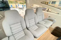 Luxury seating on 2007 Astondoa 53 Open yacht, featuring plush gray upholstery.