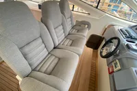 Interior of 2007 Astondoa 53 Open yacht with plush seating and wooden flooring.