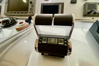 Control panel of a 2007 Astondoa 53 Open yacht, featuring throttle levers and navigation instruments.