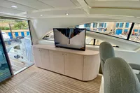 Luxurious interior of 2007 Astondoa 53 Open yacht with modern TV and seating.