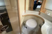 Bathroom interior of 2007 Astondoa 53 Open yacht, featuring modern fixtures and compact design.