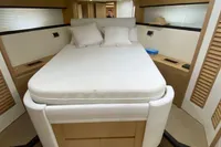 Luxurious bedroom interior of 2007 Astondoa 53 Open yacht with modern design.