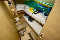 Interior cabin of 2007 Astondoa 53 Open yacht with storage items and equipment.