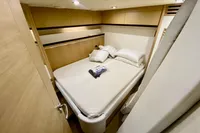 Luxurious cabin interior of 2007 Astondoa 53 Open yacht with cozy bed and modern design.