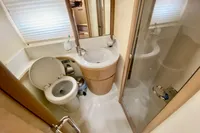 Bathroom interior of 2007 Astondoa 53 Open yacht, featuring toilet, sink, and shower.