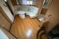 Luxurious interior of 2007 Astondoa 53 Open yacht with white leather seating and wooden flooring.