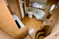 Interior of 2007 Astondoa 53 Open yacht with wooden flooring and white leather seating.