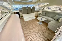 Luxurious interior of 2007 Astondoa 53 Open yacht with elegant seating and wooden flooring.