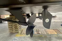 Propeller and rudder of 2007 Astondoa 53 Open yacht in maintenance area.