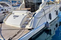 Luxury 2007 Astondoa 53 Open yacht docked in marina, showcasing sleek design and elegance.